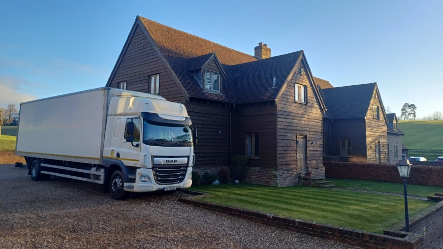 J Hanway Removals truck parked in front of a house