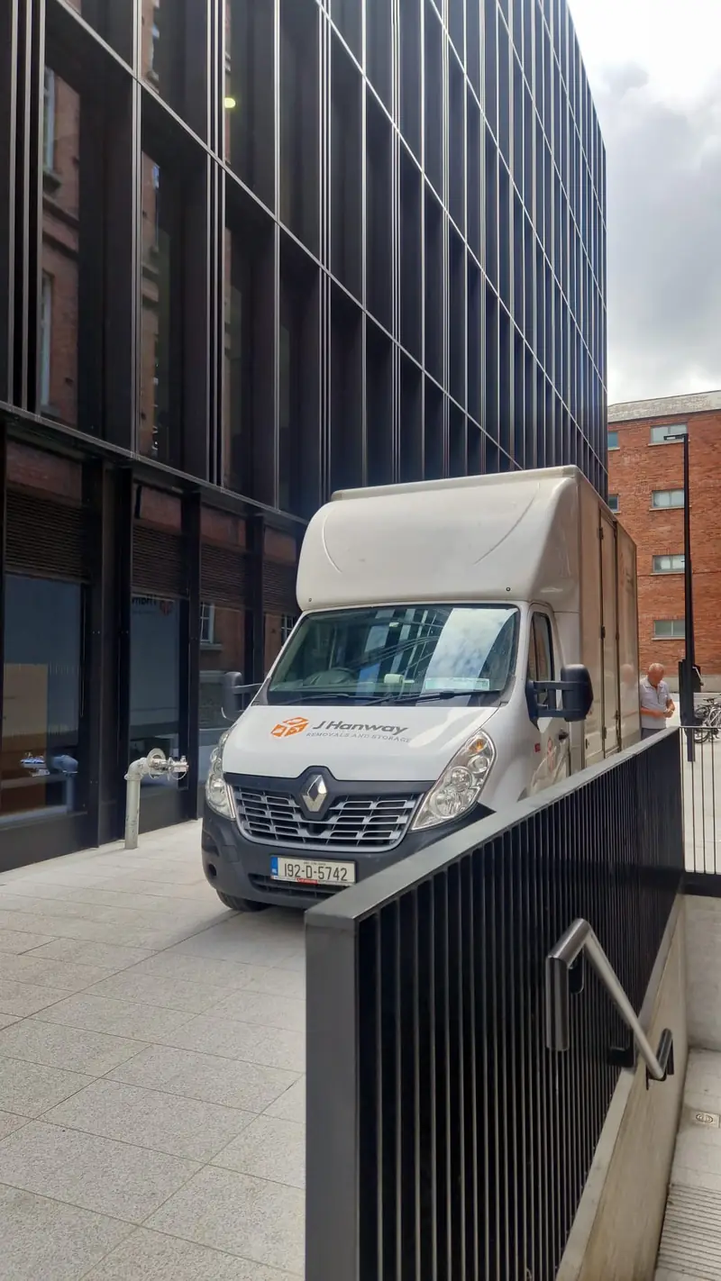 A Hanway van beside a modern office building in Dublin city centre