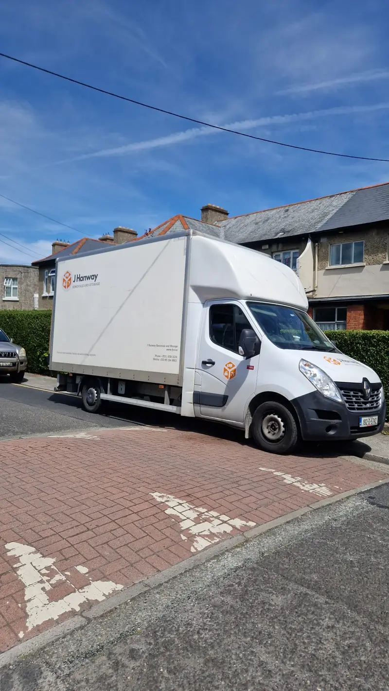 A Hanway removal van parked on a residential street in Dublin